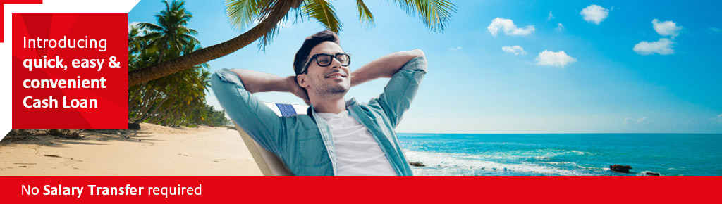 Young man relaxing on beach after acquiring a RAKBANK Cash Loan
